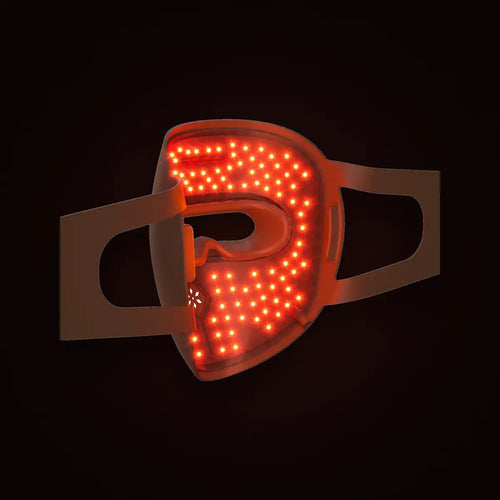 The Reset Mask face piece with red light illuminated